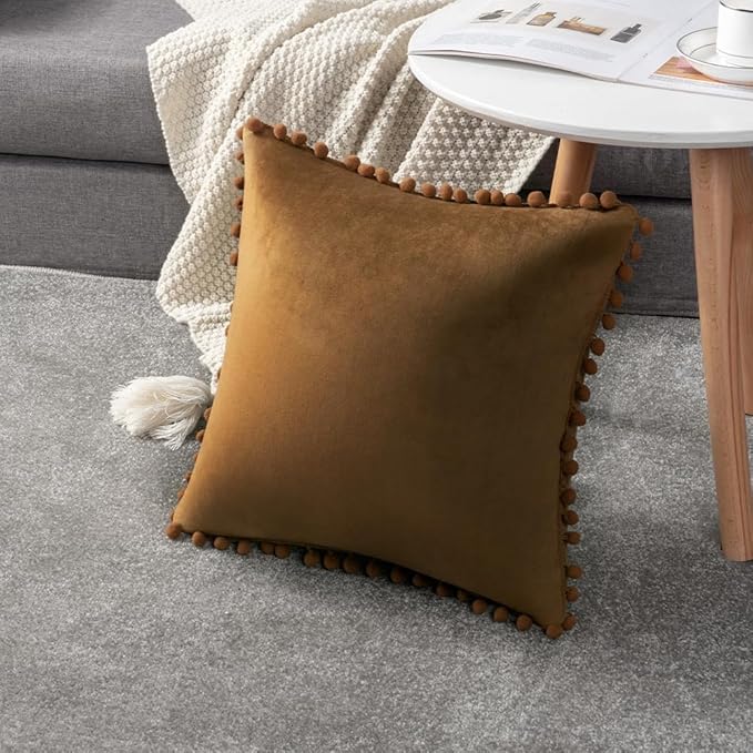 DEZENE Throw Pillow Covers with Pom-poms, 2 Pack Super Soft Velvet Decorative Pillow Cases, Square Cushion Covers Pillowcases for Farmhouse,Couch,Sofa, 24x24 Inch, Golden Brown